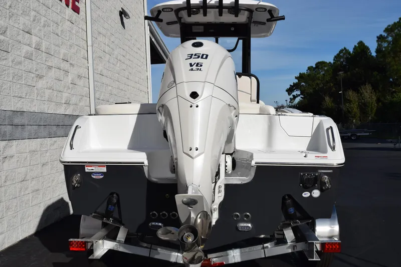 Slide: The Image of 2026 Sea Hunt Ultra 255 SE boat with powerful 350 V6 engine, rear view. - 5