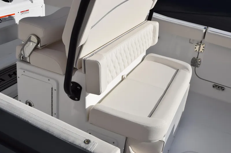 Slide: The Image of 2026 Sea Hunt Ultra 255 SE boat interior with cushioned seating. - 6