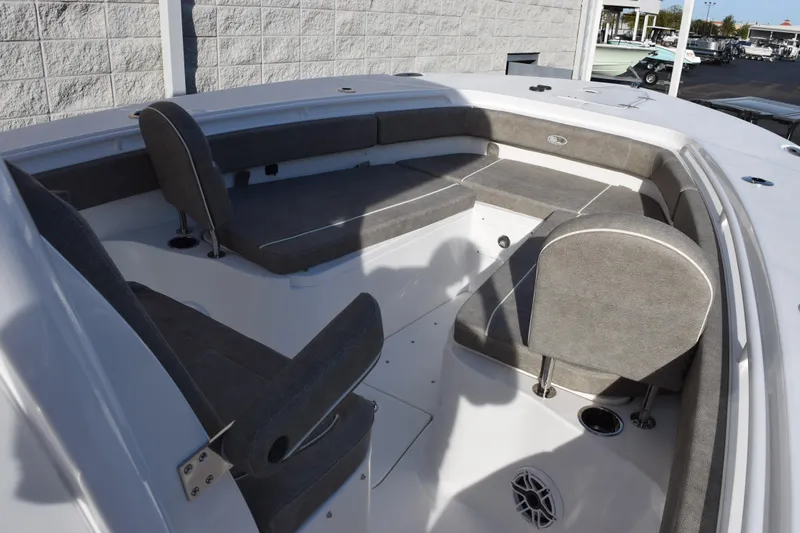 Slide: The Image of 2026 Sea Hunt Ultra 285 SE boat interior with gray seating and white deck. - 13