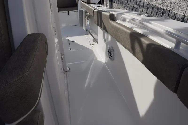Slide: The Image of 2026 Sea Hunt Ultra 285 SE boat interior with cushioned seating and sleek design. - 16