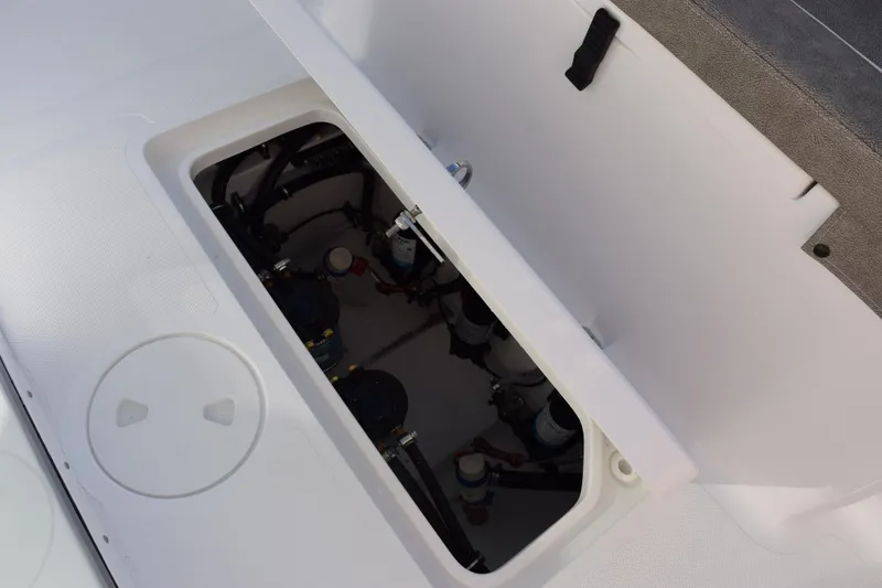 Slide: The Image of Open hatch of 2026 Sea Hunt Ultra 285 SE boat, revealing internal components. - 25