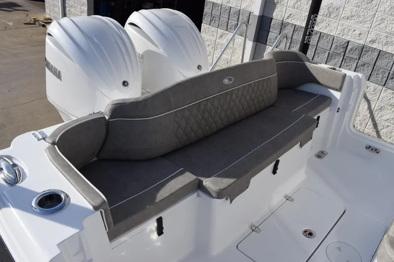 Slide: The Image of 2026 Sea Hunt Ultra 285 SE boat with dual engines and cushioned seating. - 7