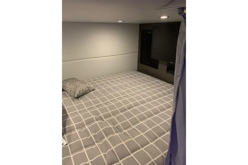 Slide: The Image of Interior cabin of 2021 Formula 380 Super Sport Crossover with bed and TV. - 10