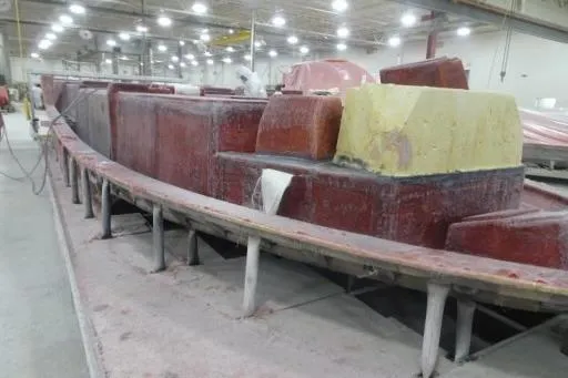 Slide: The Image of 2021 Formula 380 Super Sport Crossover I/O under construction in a factory setting. - 16