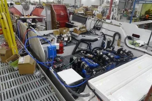 Slide: The Image of 2021 Formula 380 Super Sport Crossover I/O engine room in a manufacturing facility. - 19
