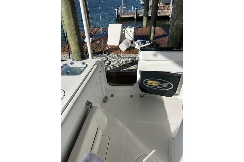 Slide: The Image of 2015 Sea Hunt Gamefish 25 boat interior with dock view. - 10