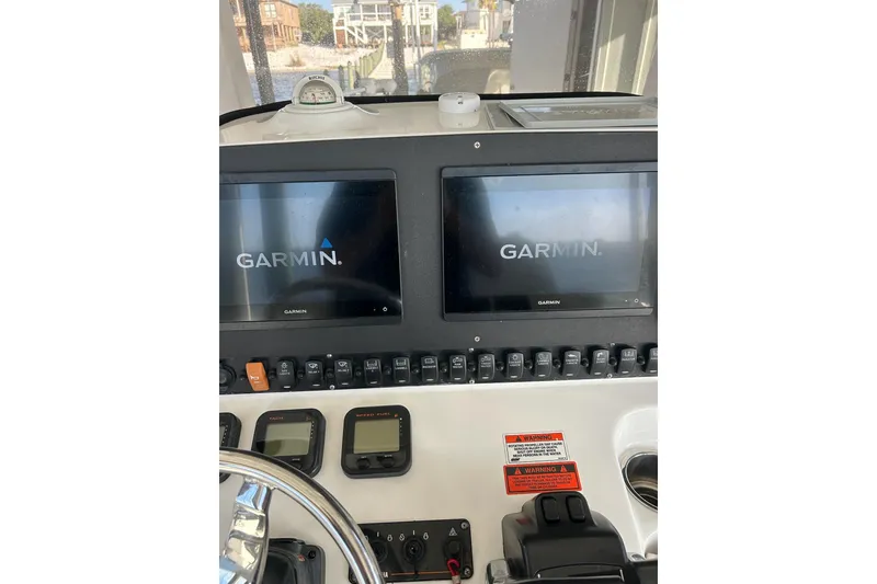 Slide: The Image of Control panel of 2015 Sea Hunt Gamefish 25 with dual Garmin displays. - 22