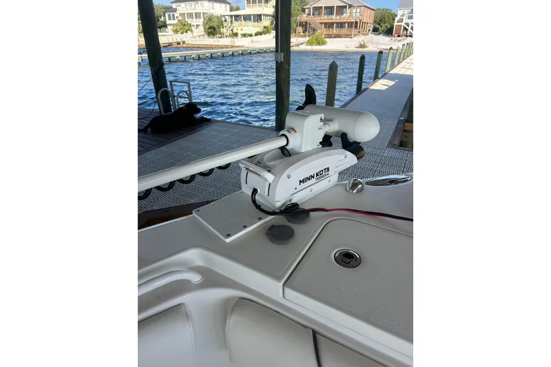 Slide: The Image of 2015 Sea Hunt Gamefish 25 with Minn Kota trolling motor at dockside. - 32