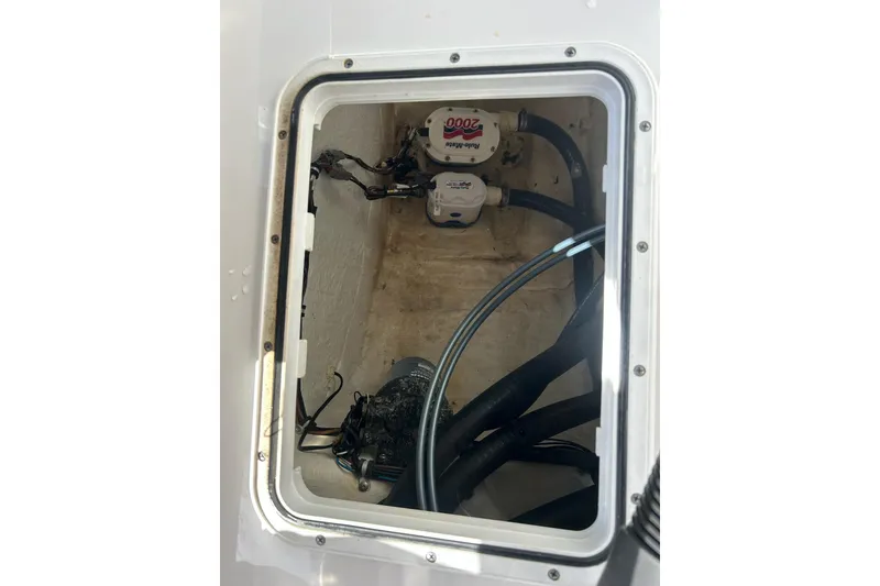 Slide: The Image of 2015 Sea Hunt Gamefish 25 bilge area with pumps and hoses visible. - 7