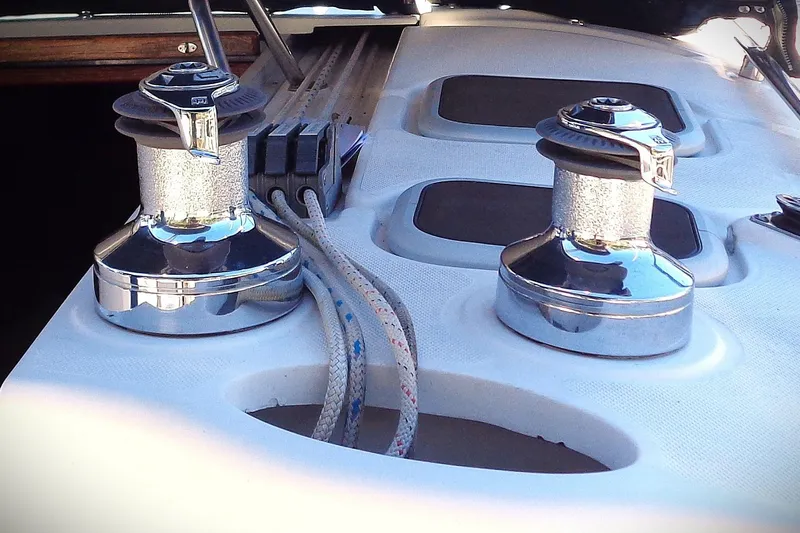 Slide: The Image of 2001 Hunter 380 sailboat docked, featuring a sleek design and spacious deck. - 18