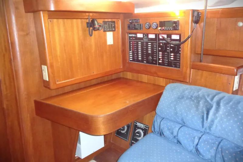 Slide: The Image of Interior of 2001 Hunter 380 yacht kitchen with wooden cabinets and modern appliances. - 6