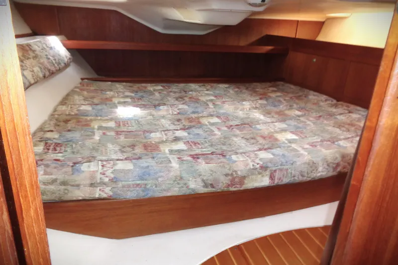 Slide: The Image of Interior of 2001 Hunter 380 sailboat with kitchen, sink, and cozy cabin area. - 7