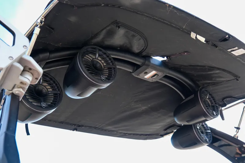 Slide: The Image of 2021 Tigé 21ZX boat speakers mounted under a black canopy. - 30