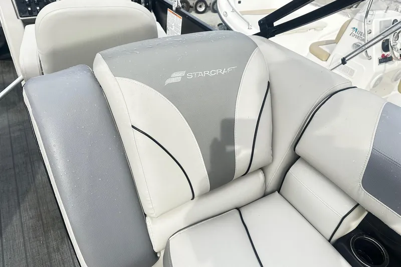 Slide: The Image of 2019 Starcraft 2210 OB Limited boat seat with gray and white upholstery. - 12