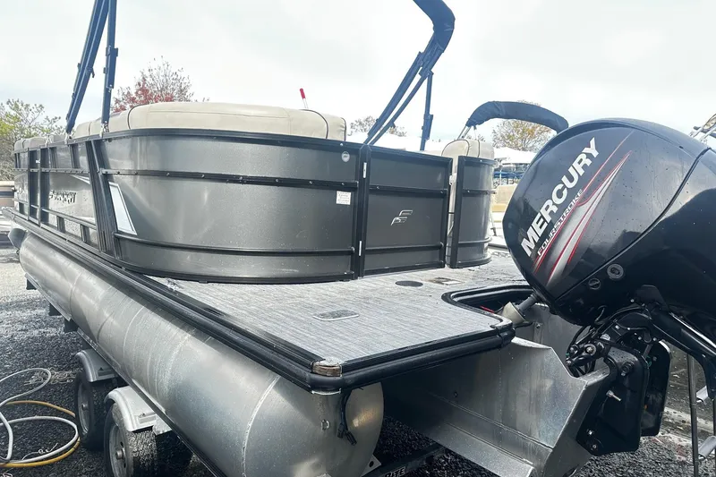 Slide: The Image of 2019 Starcraft 2210 OB Limited pontoon boat with Mercury outboard motor, on trailer. - 2