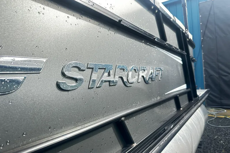 Slide: The Image of Close-up of 2019 Starcraft 2210 OB Limited boat with raindrops on metallic surface. - 3