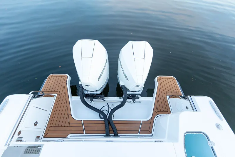 Slide: The Image of Manufacturer Provided Image: 2025 Southport 30 FE boat with dual outboard engines on calm water. - 11