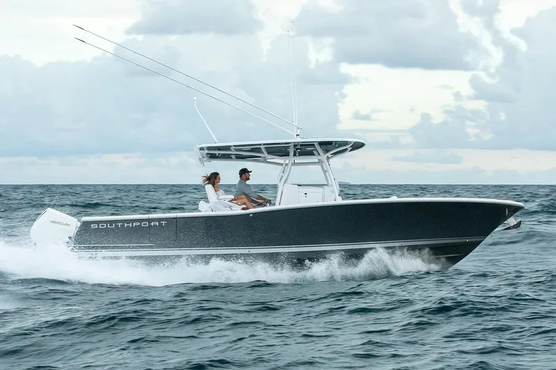 Slide: The Image of Manufacturer Provided Image: 2025 Southport 30 FE boat cruising on open water under cloudy skies. - 2