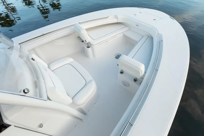 Slide: The Image of Manufacturer Provided Image: 2025 Southport 30 FE boat interior with white seating and sleek design. - 4