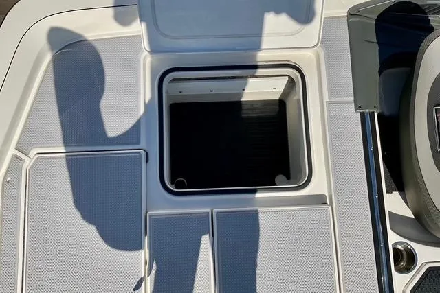 Slide: The Image of 2020 Ranger Z521L Intracoastal boat deck with open storage compartment. - 10