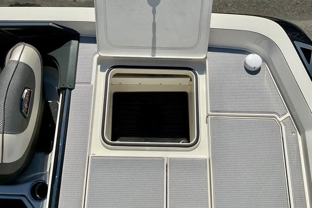 Slide: The Image of 2020 Ranger Z521L Intracoastal boat deck with open storage compartment. - 11