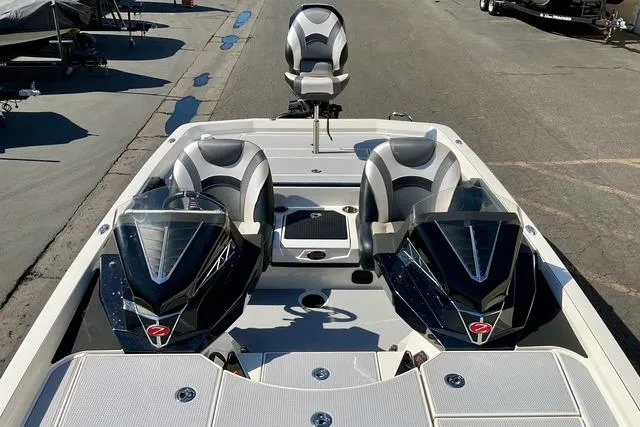 Slide: The Image of 2020 Ranger Z521L Intracoastal boat with dual consoles and seating, docked on pavement. - 17