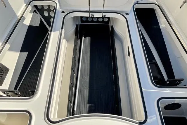 Slide: The Image of 2020 Ranger Z521L Intracoastal boat storage compartments, open and empty, showcasing interior design. - 20