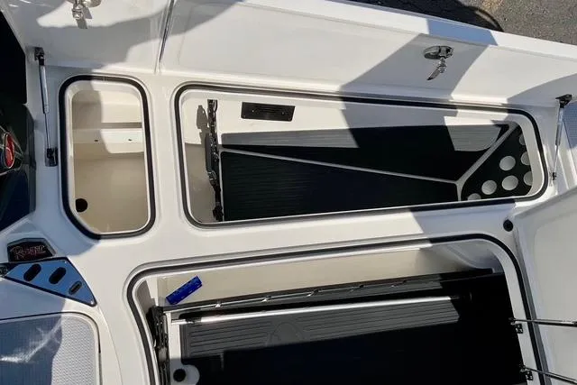 Slide: The Image of 2020 Ranger Z521L Intracoastal boat storage compartments, open and empty, showcasing interior layout. - 21