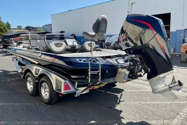 Slide: The Image of 2020 Ranger Z521L Intracoastal boat with powerful outboard motor, parked outdoors. - 3
