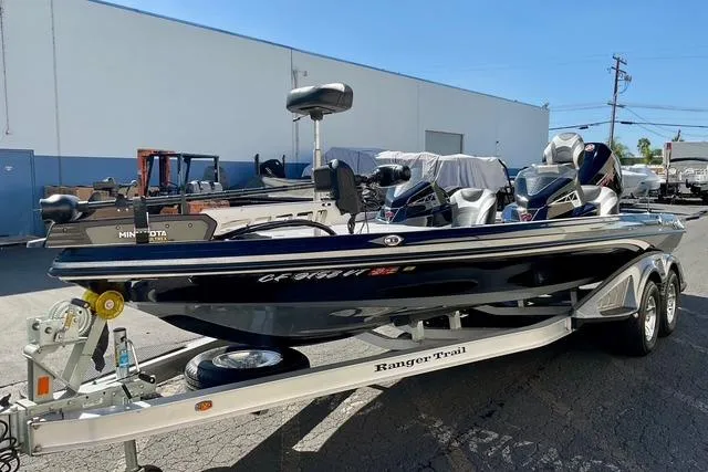 Slide: The Image of 2020 Ranger Z521L Intracoastal boat on trailer, parked outdoors. - 5