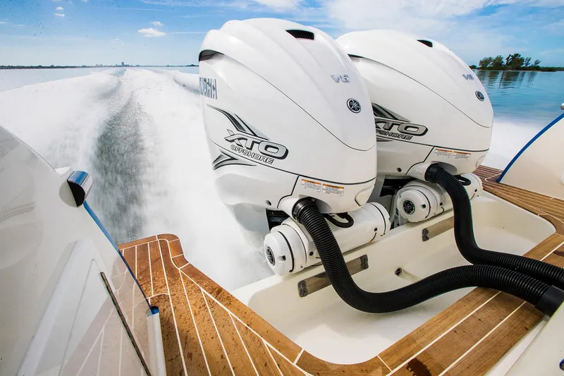 Slide: The Image of Manufacturer Provided Image: 2025 Southport 33 DC boat with dual Yamaha XTO outboard engines on water. - 11