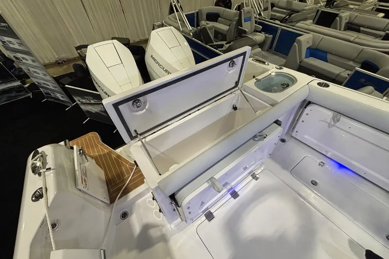 Slide: The Image of 2026 Southport 33 DC boat interior with modern helm, navigation screens, and seating area. - 14