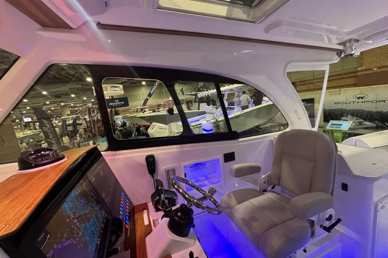 Slide: The Image of 2026 Southport 33 DC boat interior with modern bathroom amenities and sleek design. - 17