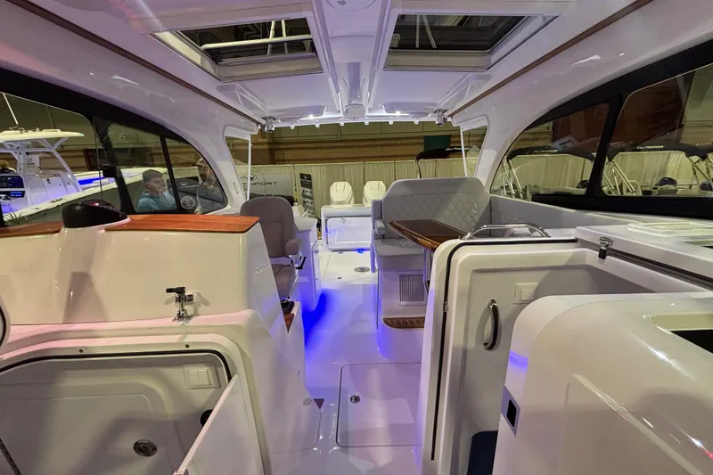 Slide: The Image of 2026 Southport 33 DC cabin interior with sleek, modern design and comfortable sleeping area. - 21