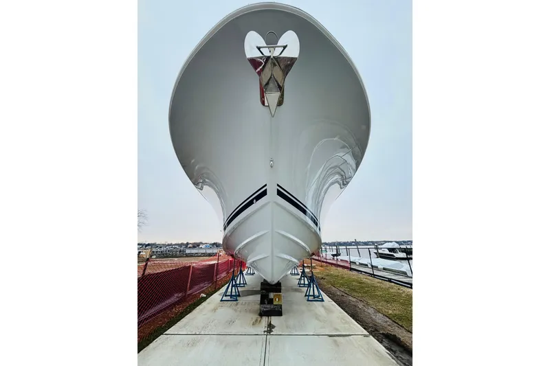 Slide: The Image of 2026 Southport 33 DC boat on display, viewed from the front, with marina background. - 30