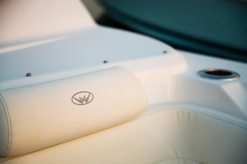 Slide: The Image of Manufacturer Provided Image: 2025 Southport 33 DC boat interior with logo on white upholstery. - 8