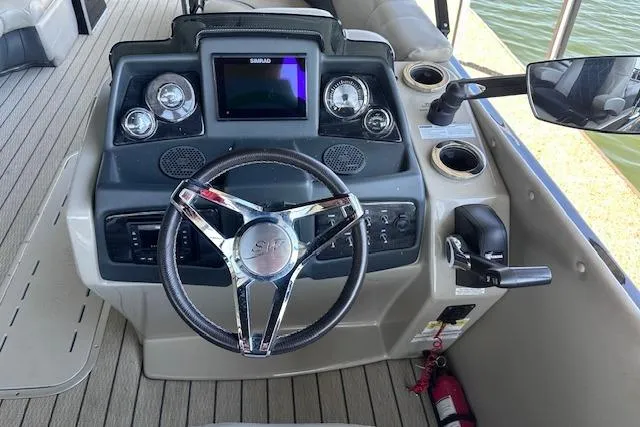Slide: The Image of Steering console of 2021 Silver Wave 2410 SW7 JS boat with modern controls and gauges. - 11