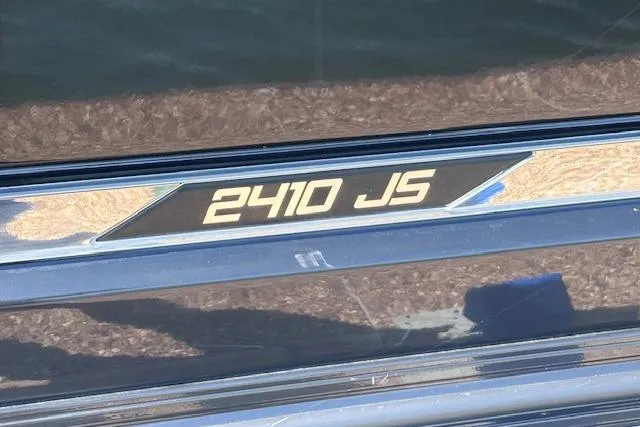 Slide: The Image of 2021 Silver Wave 2410 SW7 JS boat model emblem on sleek surface. - 12