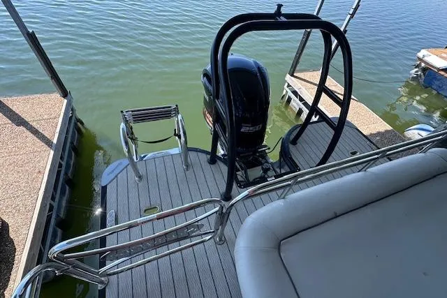 Slide: The Image of 2021 Silver Wave 2410 SW7 JS boat with outboard motor at dock. - 14