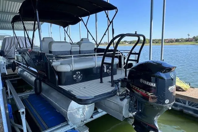 Slide: The Image of 2021 Silver Wave 2410 SW7 JS pontoon boat docked with Yamaha outboard motor. - 3
