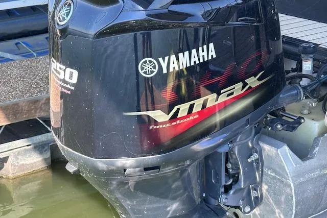 Slide: The Image of Yamaha VMAX outboard motor on 2021 Silver Wave 2410 SW7 JS boat, docked in water. - 6