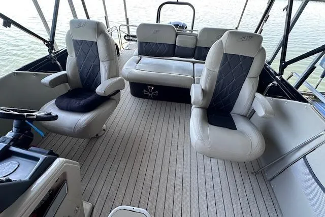 Slide: The Image of Interior of 2021 Silver Wave 2410 SW7 JS boat with plush seating and steering console. - 8