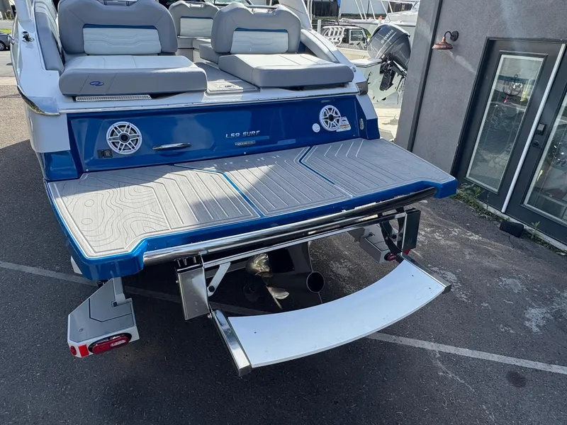 Slide: The Image of 2025 Regal LS9 Surf boat rear view with swim platform and speakers. - 30
