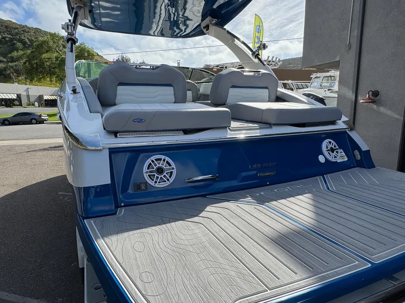 Slide: The Image of 2025 Regal LS9 Surf boat with sleek design and spacious seating. - 33