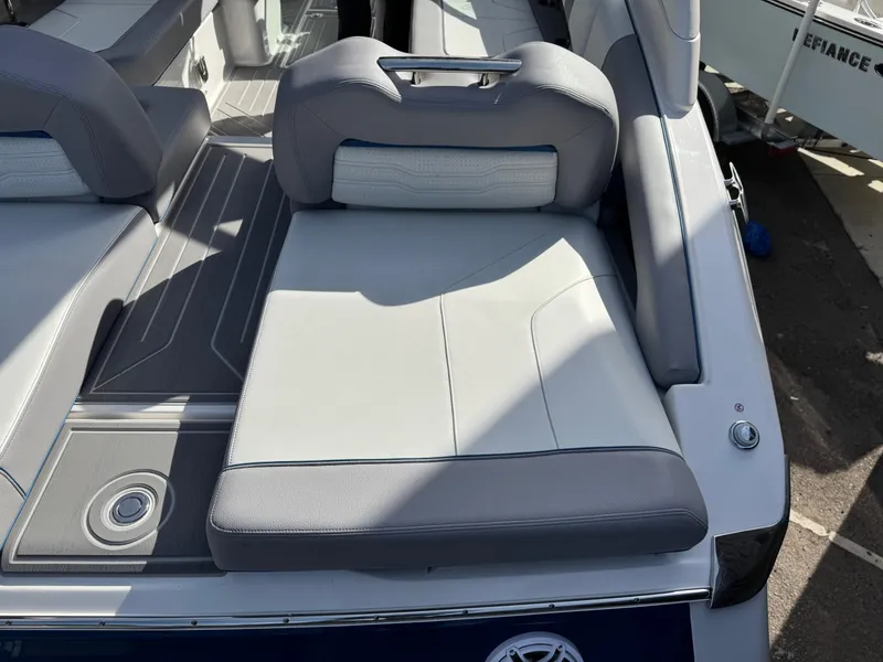 Slide: The Image of 2025 Regal LS9 Surf boat with gray and white seating, showcasing modern design. - 40