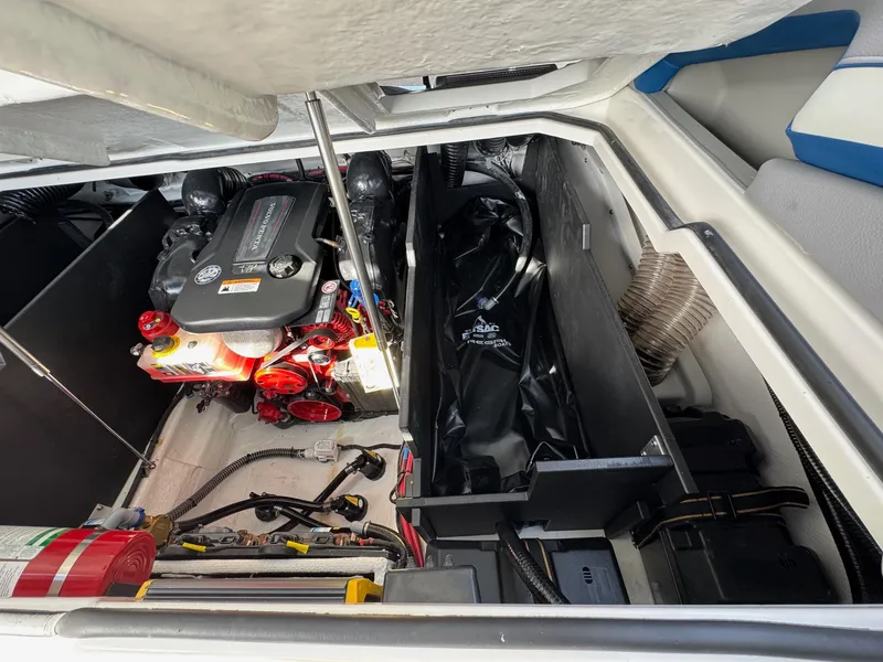 Slide: The Image of Engine compartment of 2025 Regal LS9 Surf boat, showcasing detailed components and storage. - 53