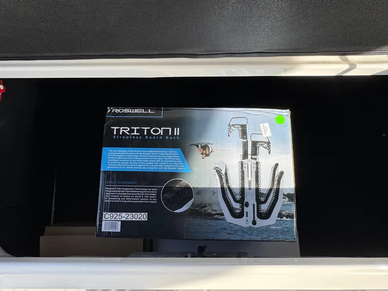 Slide: The Image of Box of Roswell Triton II surf racks inside a 2025 Regal LS9 Surf boat compartment. - 58