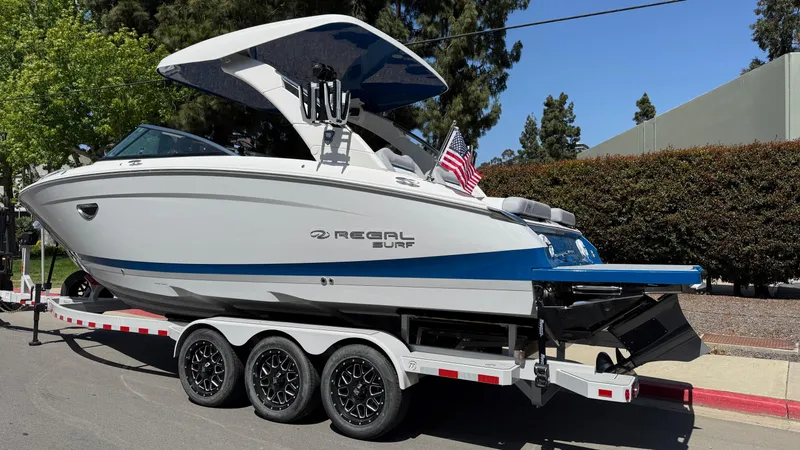 Slide: The Image of 2025 Regal LS9 Surf boat hull with trailer and propeller detail. - 7