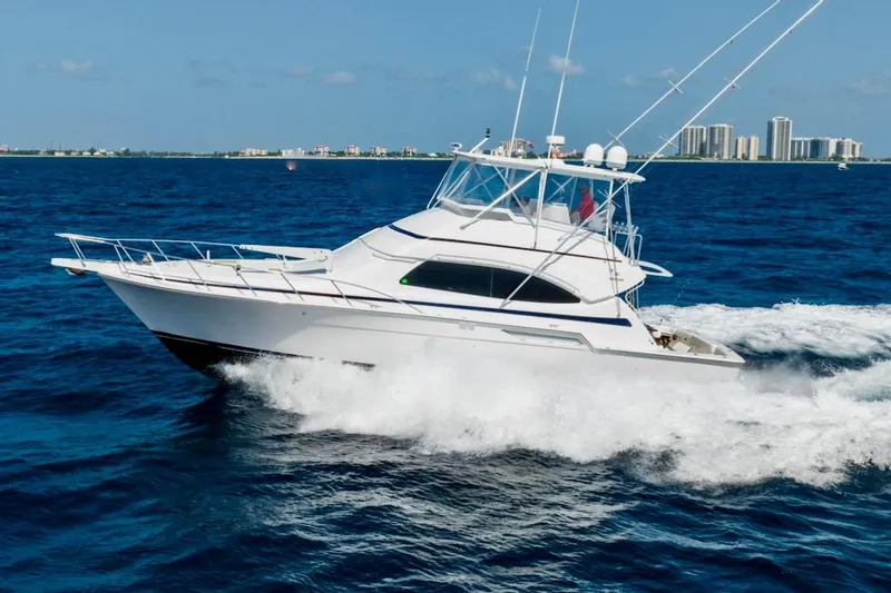 The Image of 2001 Bertram 510 Convertible yacht cruising on open blue ocean waters. - 0