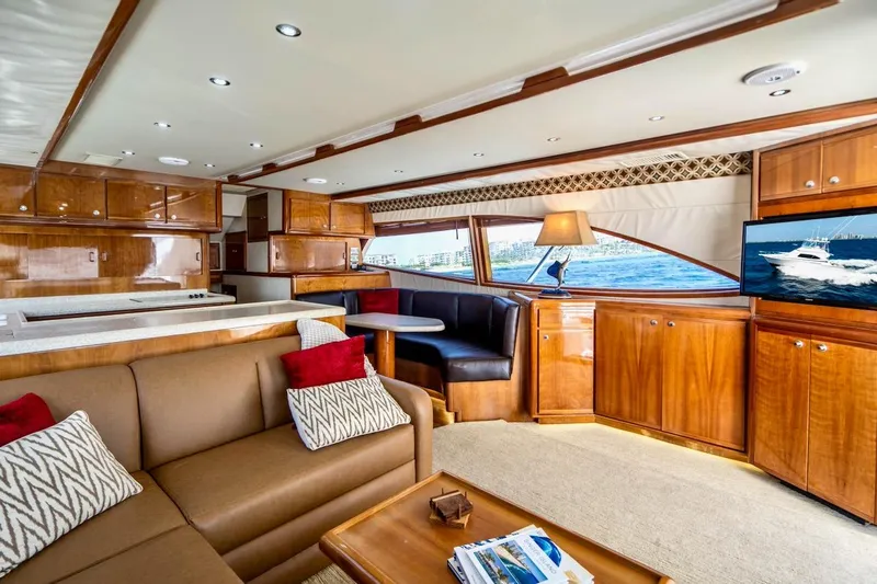 Slide: The Image of Luxurious interior of 2001 Bertram 510 Convertible yacht with elegant wood finishes and modern amenities. - 1